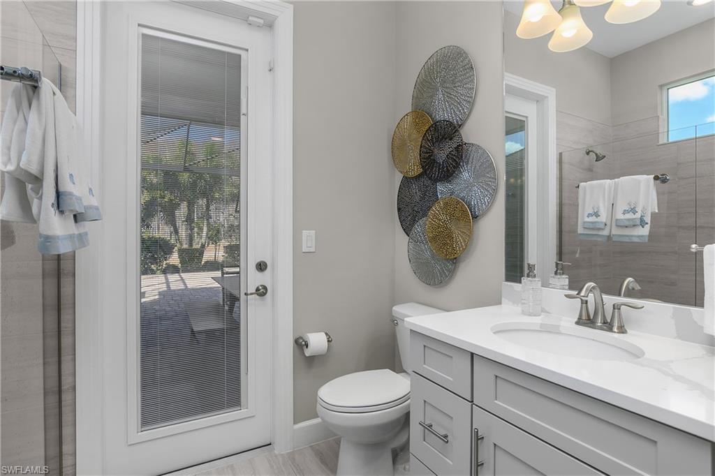 Bathroom with a tile shower and vanity