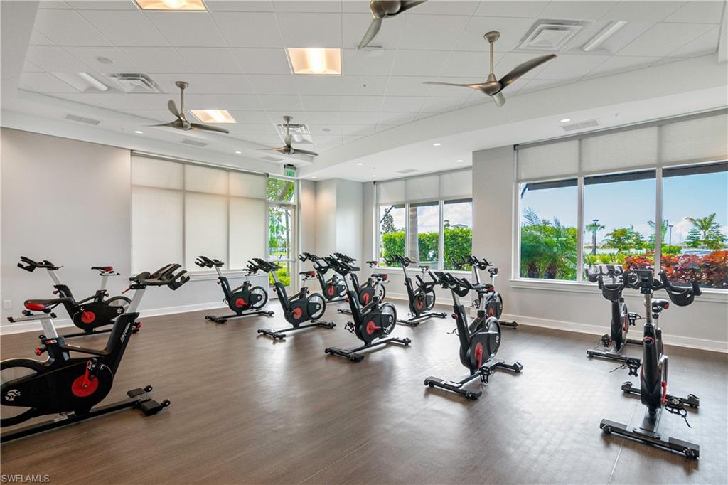 Workout area with a paneled ceiling and a ceiling fan
