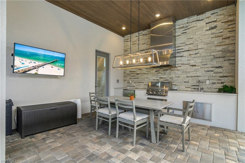 Dining room with wood ceiling and recessed lighting