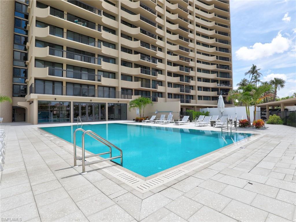 Community pool with a patio