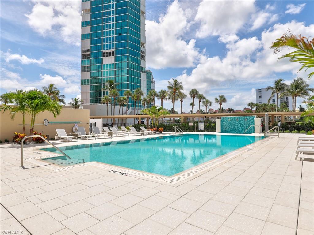 Community pool with a patio