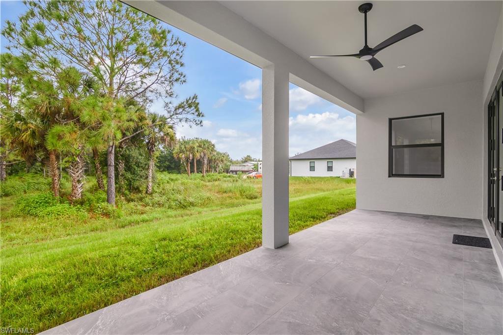 View of patio featuring ceiling fan
