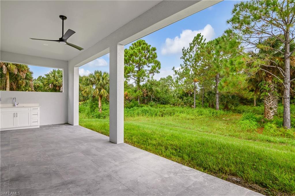 View of patio / terrace with exterior kitchen and a ceiling fan