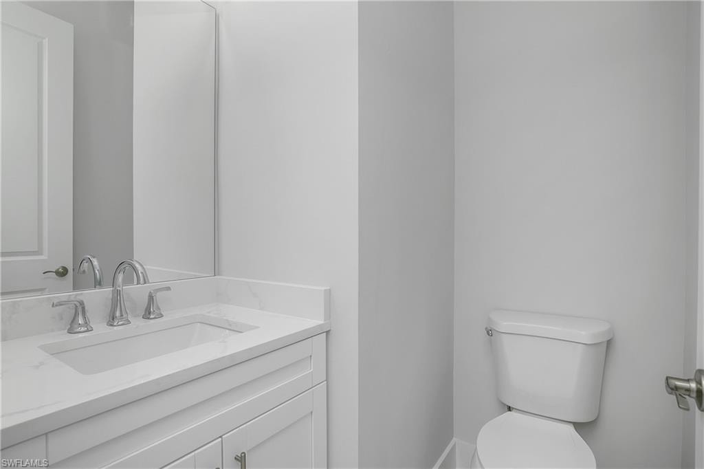 Bathroom featuring toilet and vanity