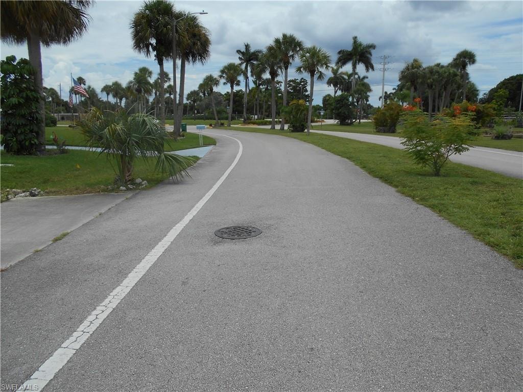 View of asphalt street with street lighting