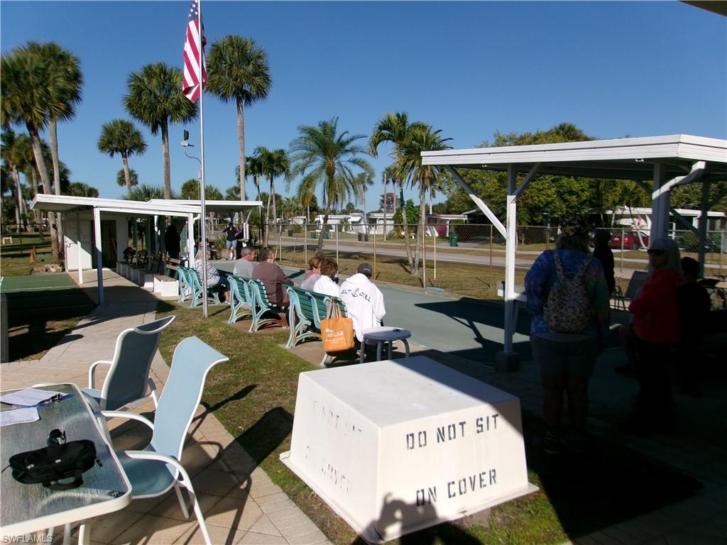 Dock area with a patio area and a yard