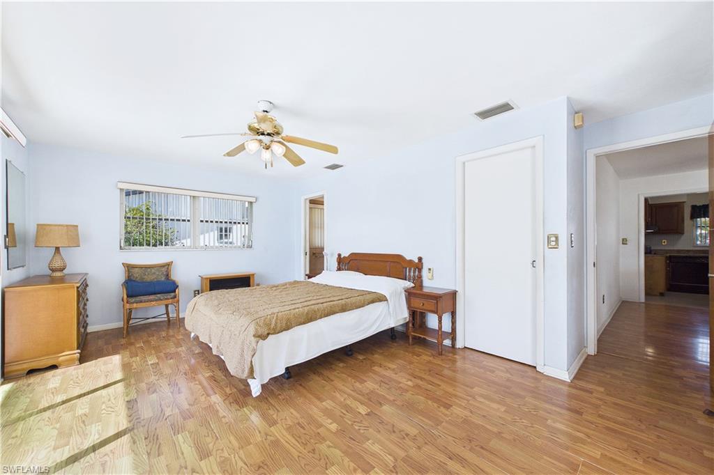 Bedroom with light wood-style flooring and ceiling fan