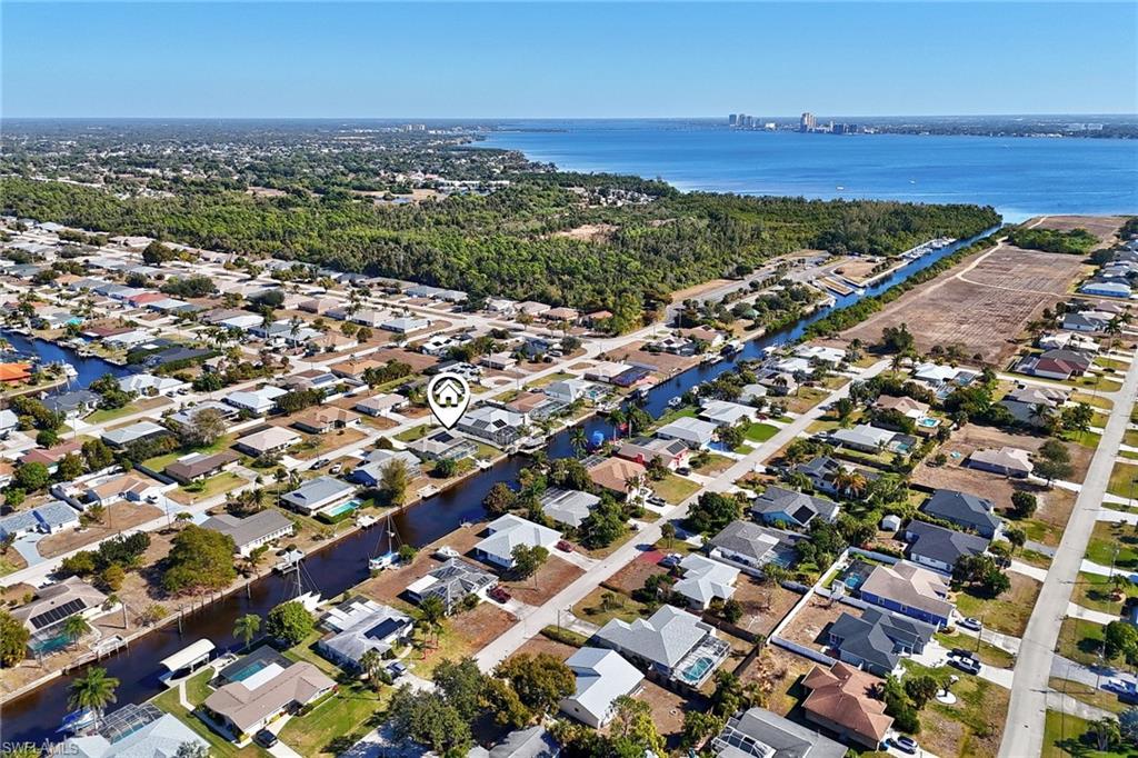 View of property location with nearby suburban area and a large body of water