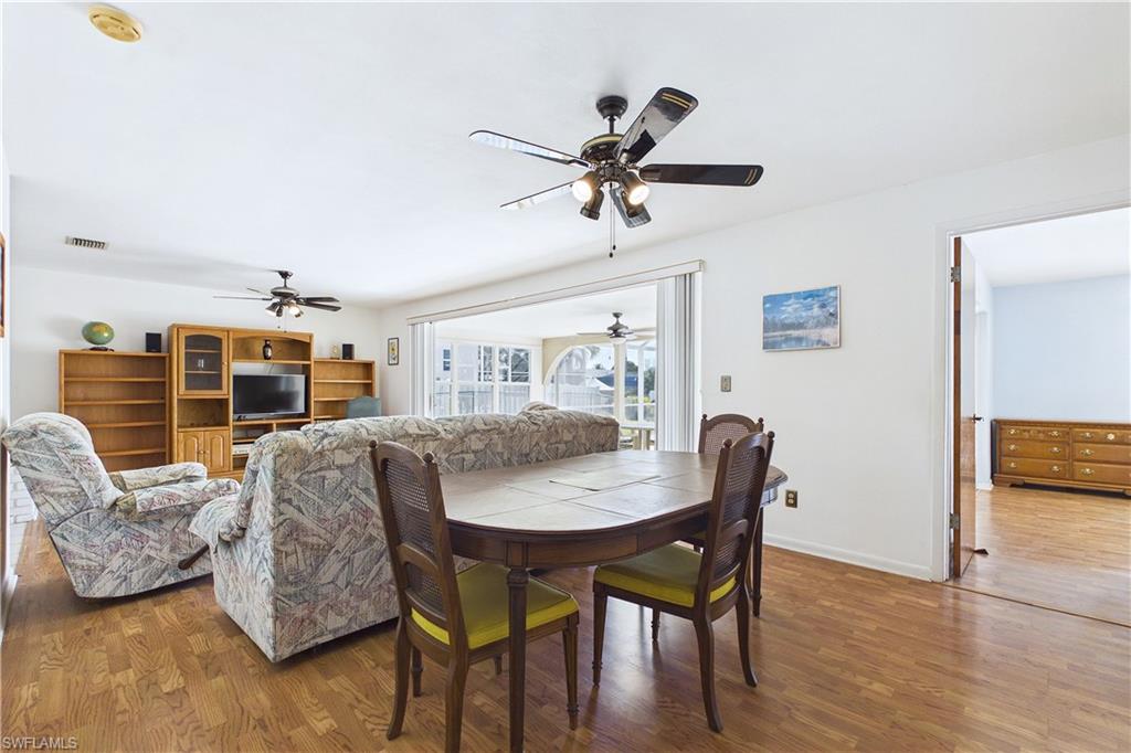 Dining space featuring wood finished floors and baseboards