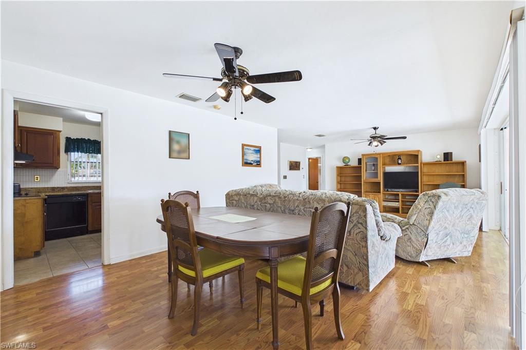 Dining space with light wood-type flooring and a ceiling fan
