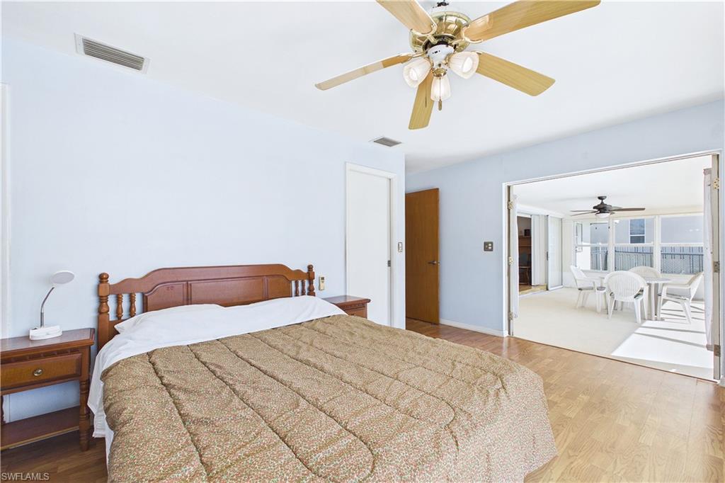 Bedroom featuring wood finished floors and ceiling fan