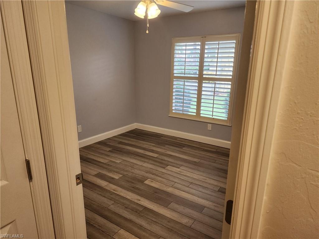 Bedroom room with vinyl wood-style flooring and ceiling fan