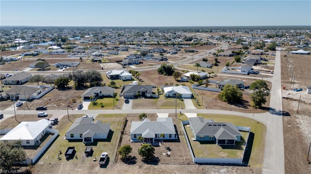 Aerial overview of property's location featuring nearby suburban area