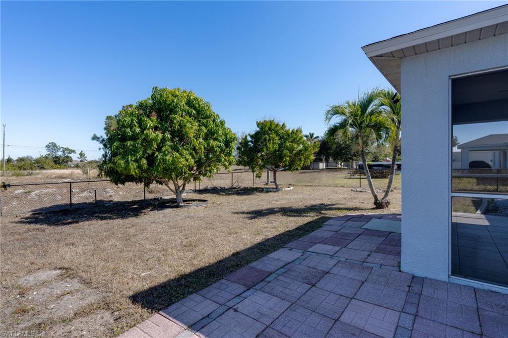 Fenced yard featuring a patio