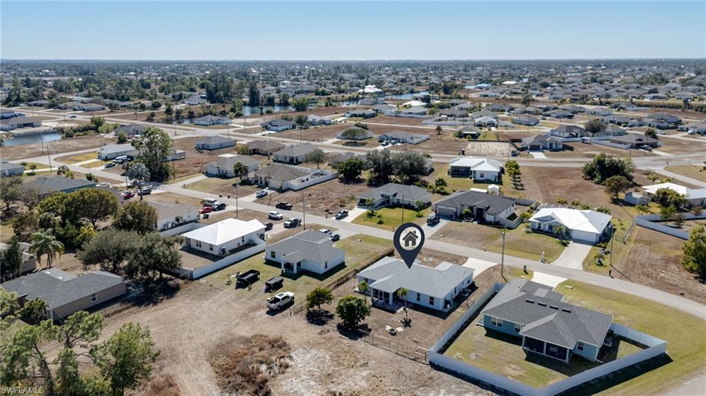 Aerial overview of property's location with nearby suburban area