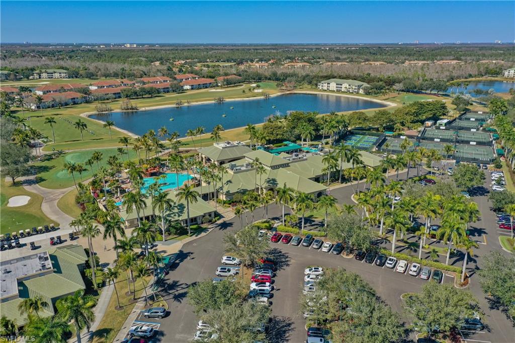 Aerial view of property's location with a nearby body of water and a golf course
