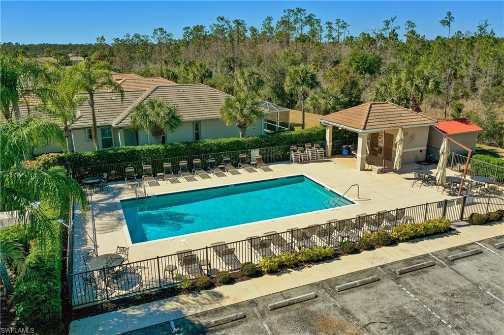 Community pool with a patio