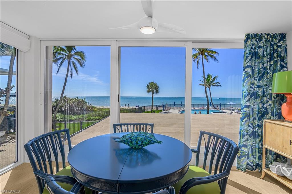 Sunroom featuring a Pool and Gulf water view