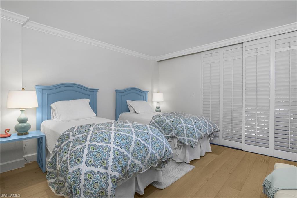 2nd Bedroom with wood finished floors and ornamental molding