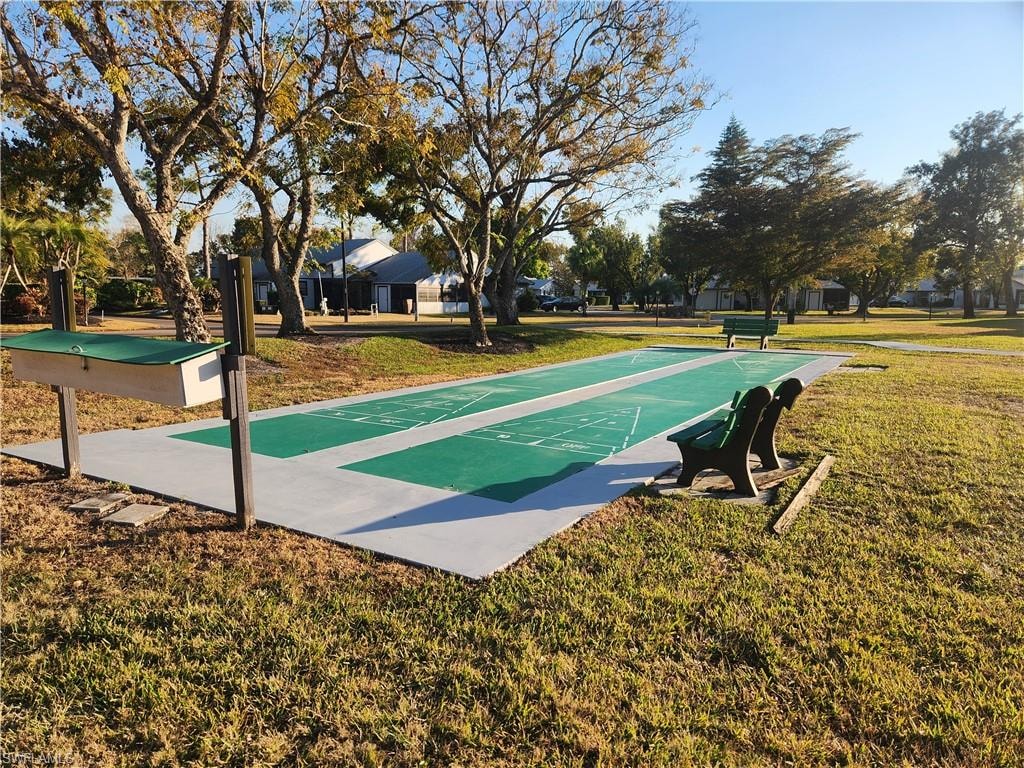 View of property's community with shuffleboard