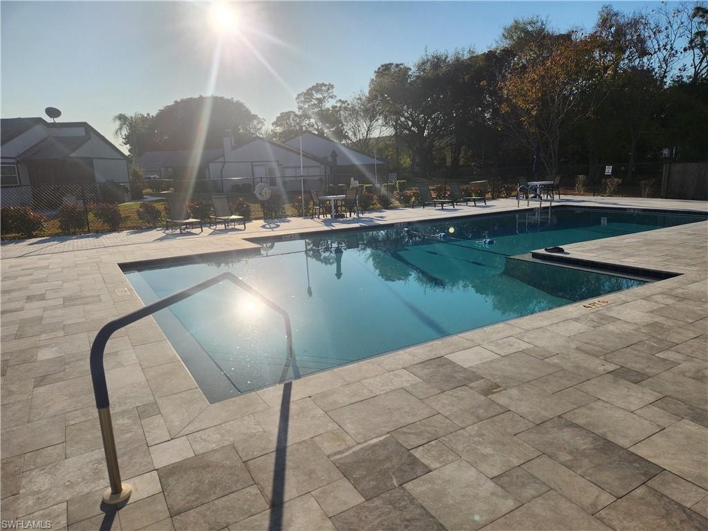 Community pool featuring a patio area