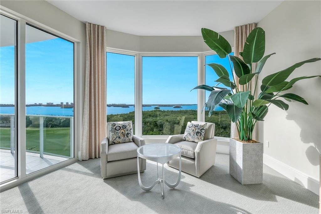 This private sitting nook offers tranquil vistas of the bay and Gulf, complemented by convenient lanai access.