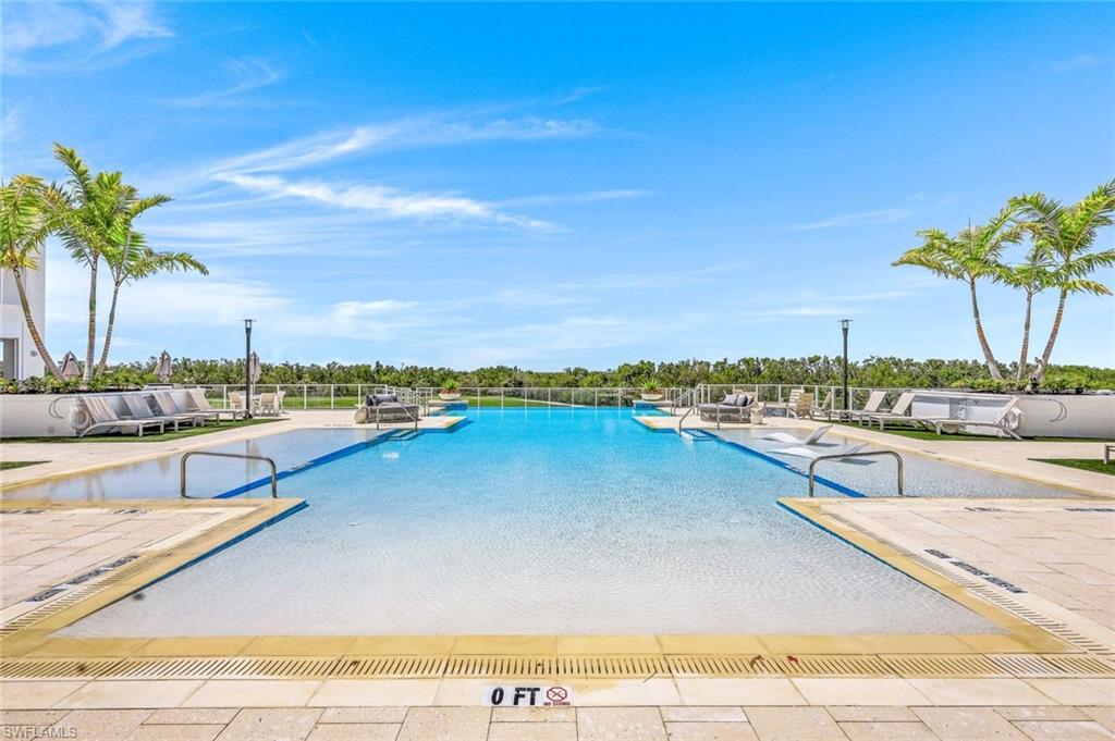 A lagoon-inspired pool with a gently sloping, beach-style entrance.