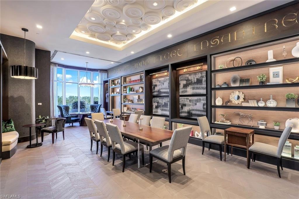 This stunning card room evokes old-world European charm, complete with deep wood finishes and finely crafted tables.