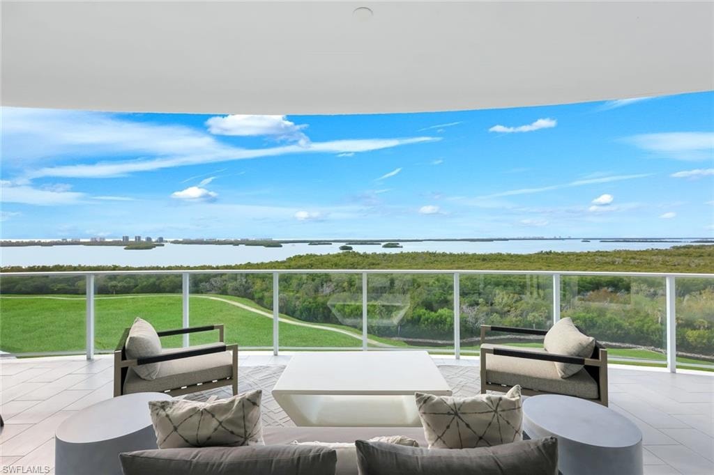A spectacular vantage point from the lanai overlooking the lush golf course and tranquil bay below.