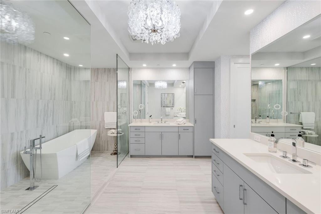 Designed with relaxation in mind, the primary ensuite showcases a soaking tub, dual sinks, and a generously scaled walk-in shower.