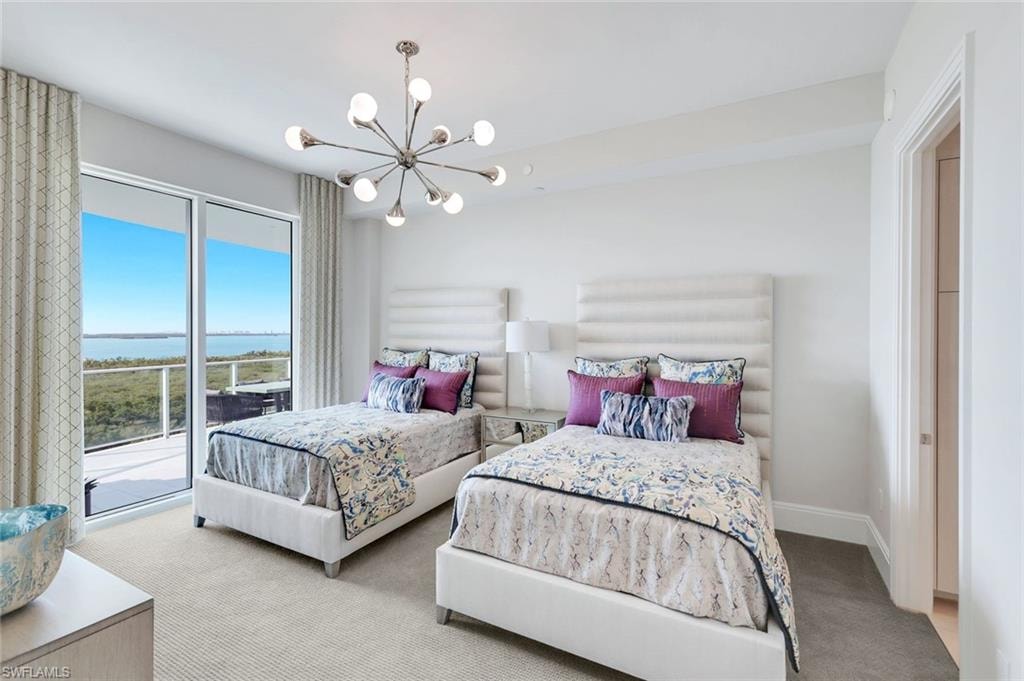 This inviting second guest bedroom enjoys tranquil views, seamless lanai access, and a private ensuite bath.