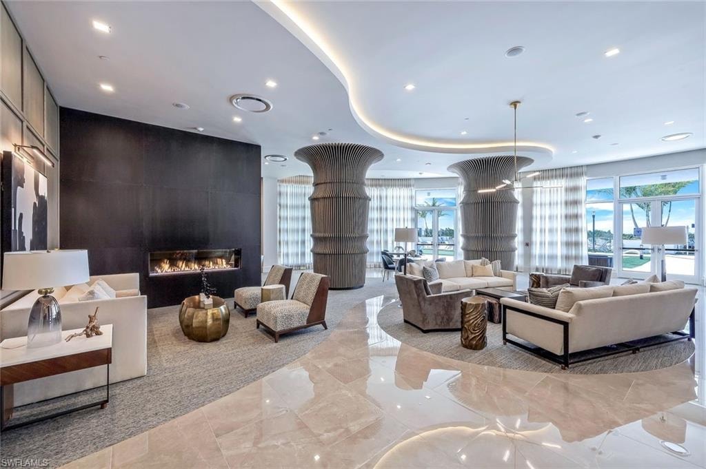This vantage point highlights the lobby’s warm wood tones and elegant decorative fireplace.