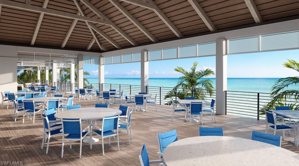 The upper-level deck provides a stunning vantage point above the beach, perfect for sunset gatherings.