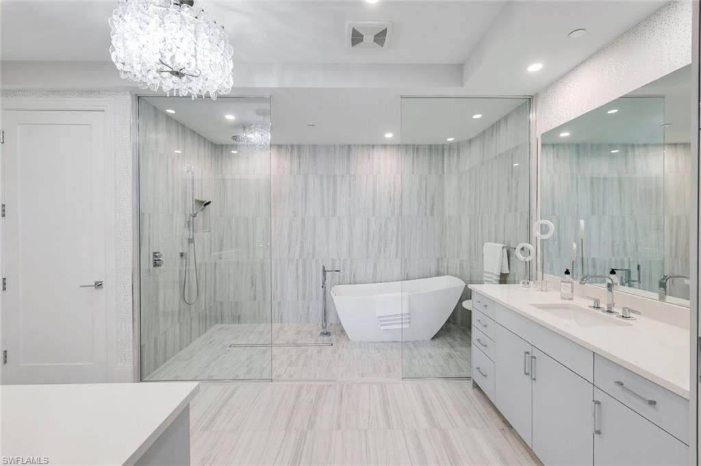 The expansive walk-in shower and soaking tub invite moments of pure relaxation.