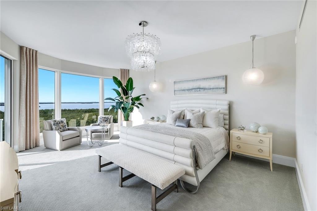 Warm natural tones and bespoke designer details define the primary retreat, all framed by captivating vistas beyond.