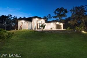 View of front of house featuring a front lawn