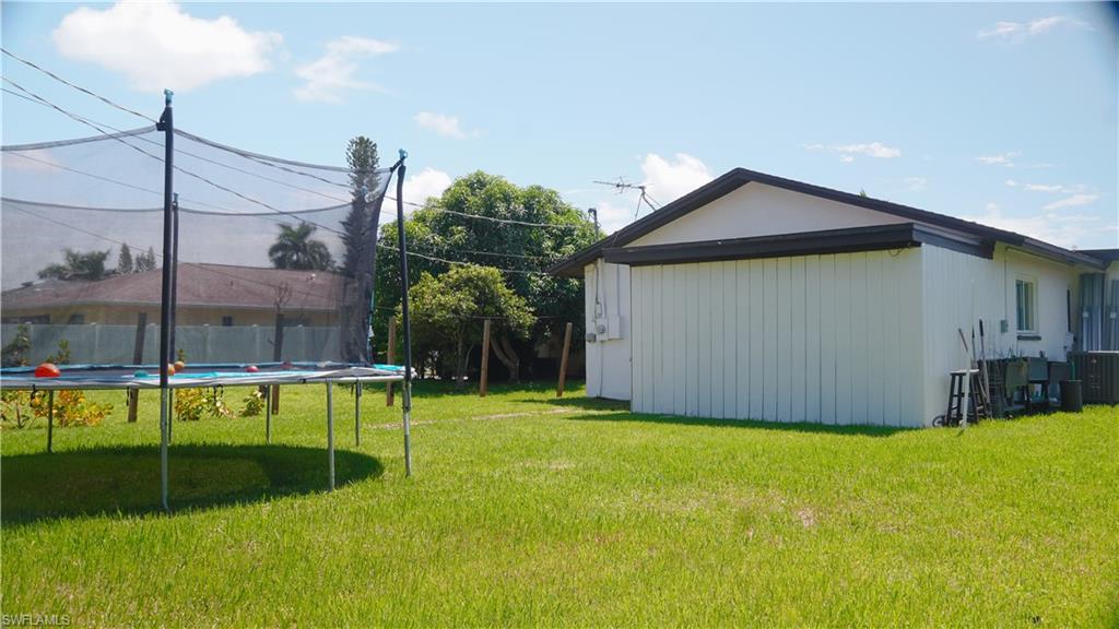 View of yard with a trampoline
