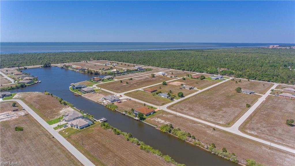 Aerial view of property's location featuring a nearby body of water