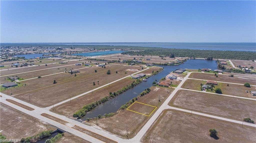 Aerial overview of property's location featuring property parcel outlined and a large body of water