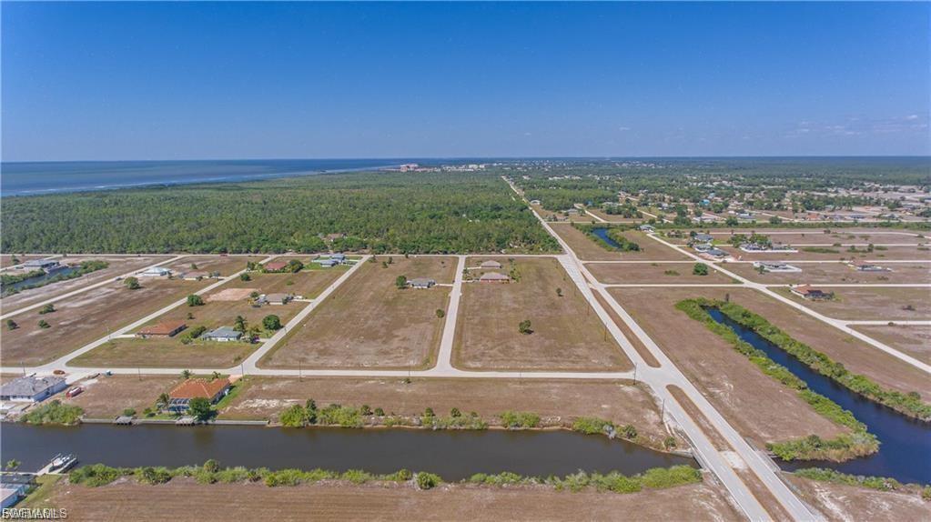 Aerial view of a large body of water and a heavily wooded area