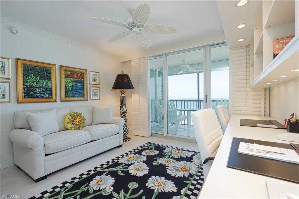 Living room with ornamental molding, ceiling fan, a water view, and recessed lighting