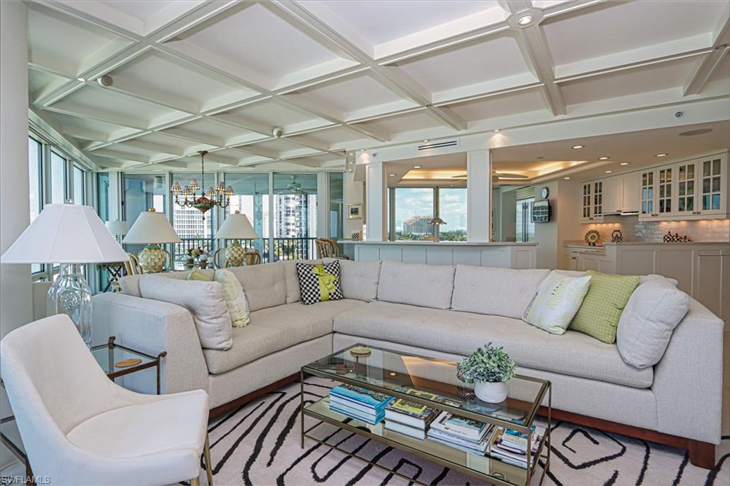 Living area with coffered ceiling and a chandelier