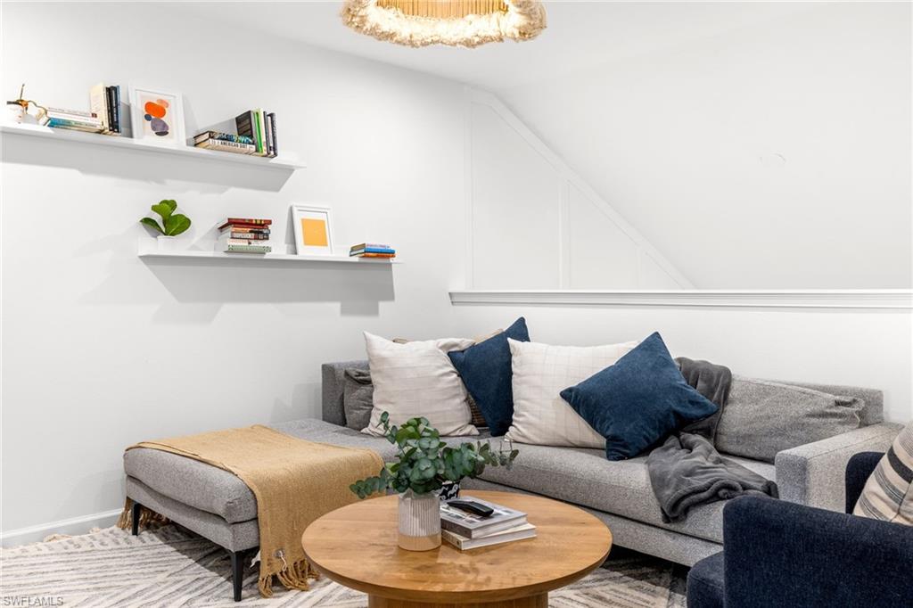 Living room featuring lofted ceiling