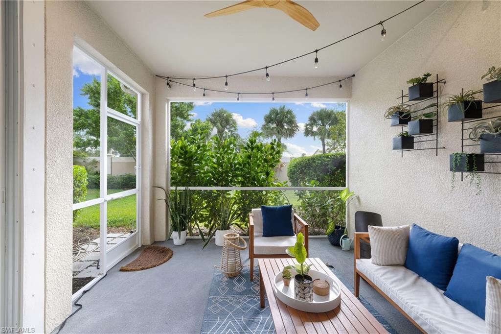 Sunroom featuring ceiling fan, outdoor seating, and lofted ceiling