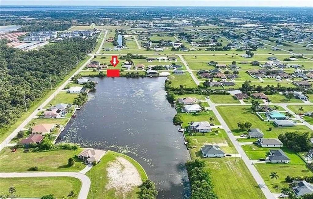 Aerial overview of property's location featuring a nearby body of water