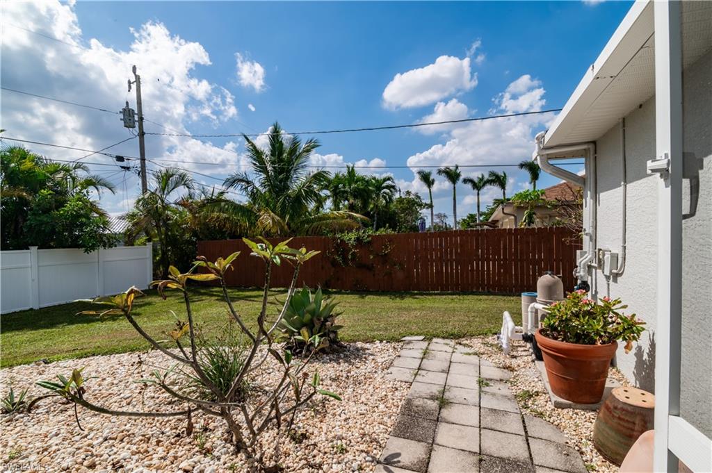Fenced backyard featuring a patio