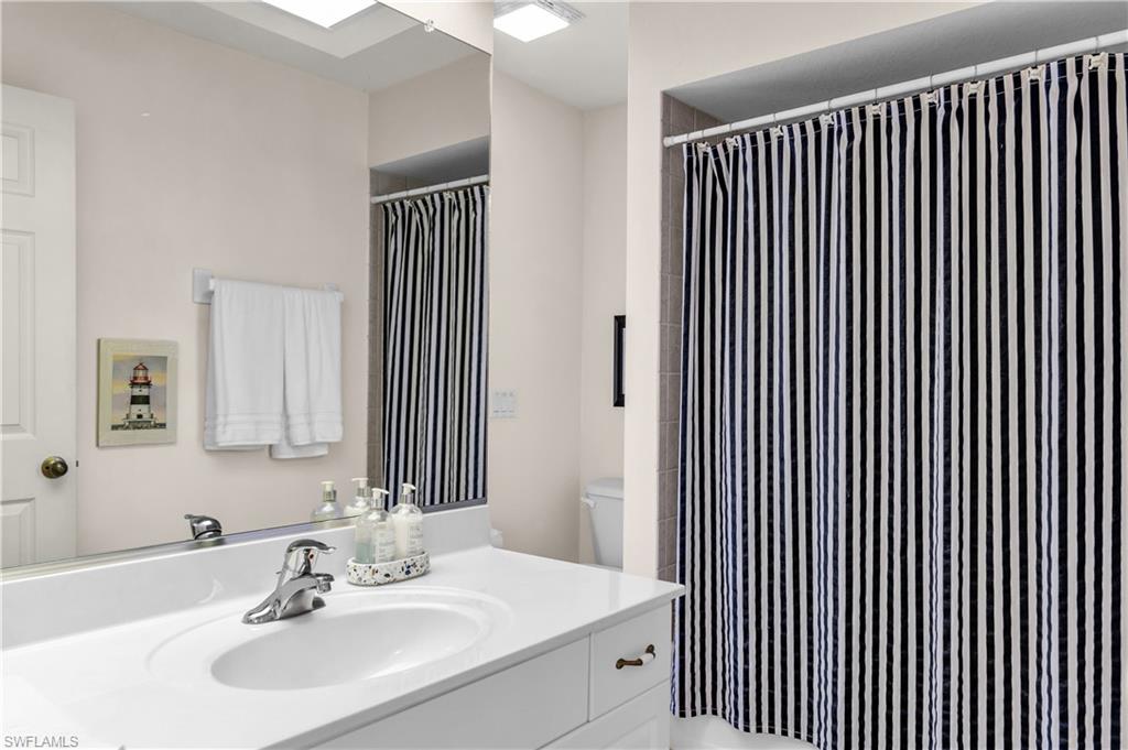 Full bathroom featuring vanity and a shower with curtain