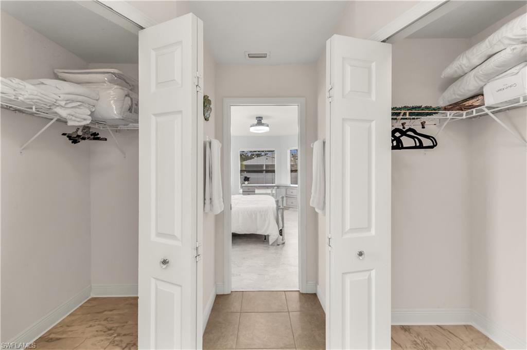 Walk in closet featuring light tile patterned floors