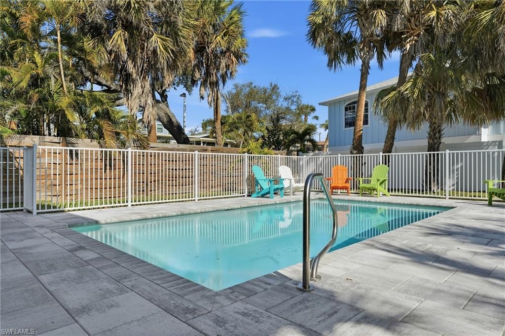 View of swimming pool with patio surround - Virtually Edited Image