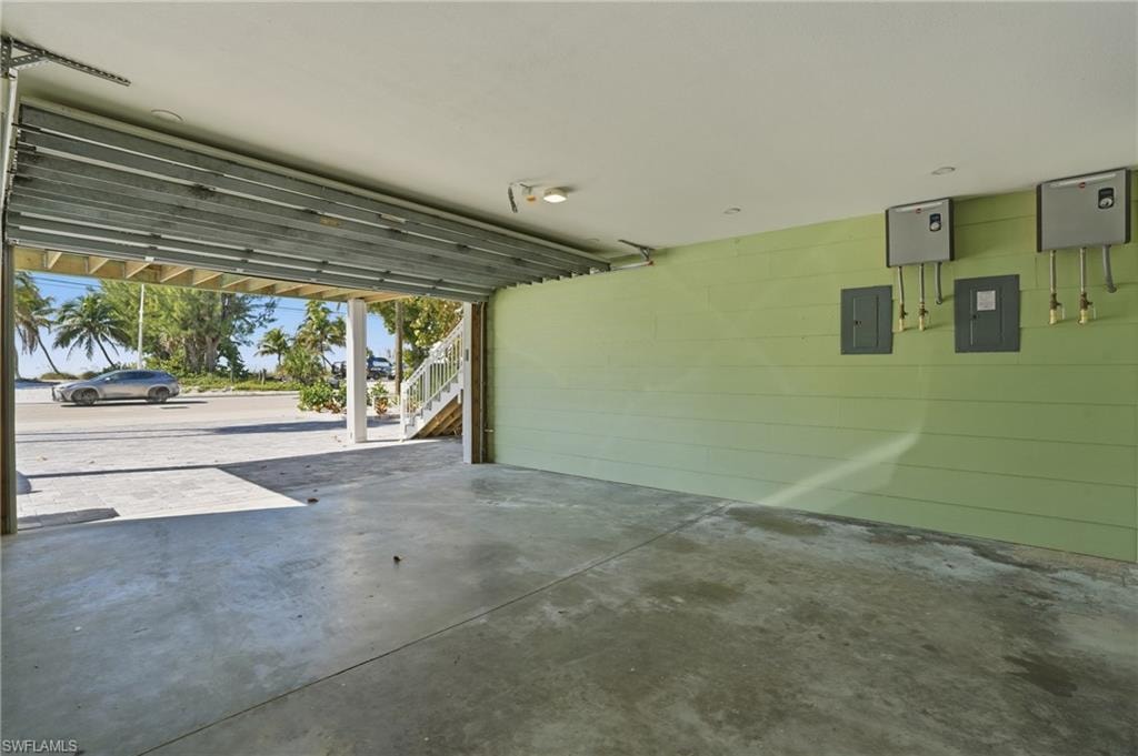 Garage with electric panel and concrete block wall - Virtually Edited Image